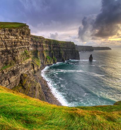 Red Orchid Travel will guide you to the breathtaking Cliffs of Moher in Ireland, where you can hike the picturesque countryside along the cliffs.