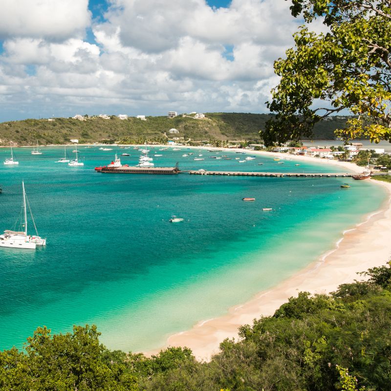 Day 2 of Treasure Islands cruise with Red Orchid Women’s Travel - Columbus thought this long flat island with its multitude of white sand coves looked like an undulating eel, so he named it Anguilla.