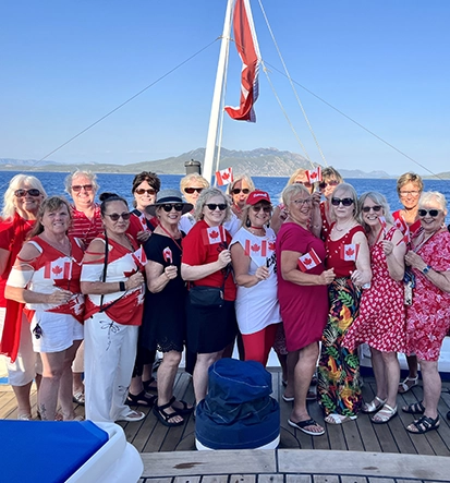 Red Orchid Travel Women's Club group wearing their Canada T-shirts while on the Star Clipper.