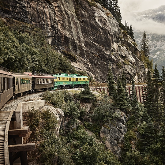 The "Scenic Railway of the World" links Skagway with Yukon, Canada. A 41-mile roundtrip offers an unforgettable journey to the summit of the White Pass at nearly 3,000 feet in elevation.