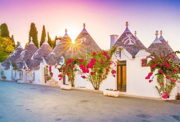 This afternoon, arrive in Alberobello, a whimsical city known for its trulli , stone huts with cone-shaped roofs. Meander with your guide through a labyrinth of these gnomish houses, some adorned with symbols carrying religious or astrological meanings.
